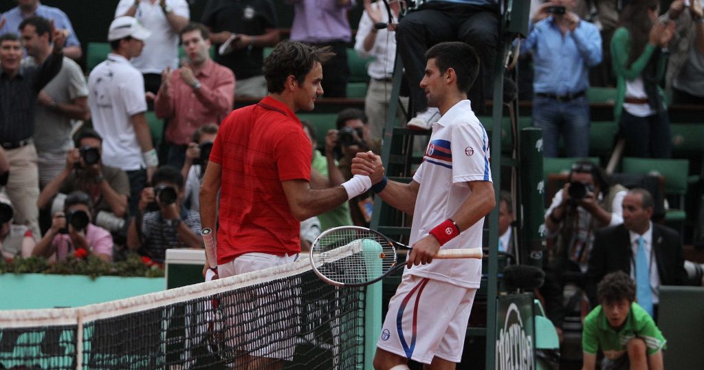 Roger Federer and Novak Djokovic shake hands after their 2011 semi-final in Paris.