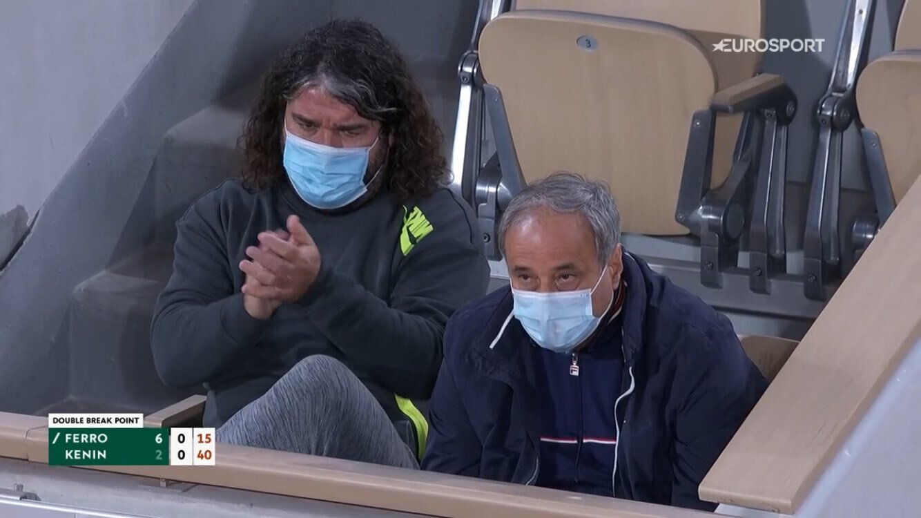 Emmanuel Planque and Alex Kenin sitting next to each other during their players' match