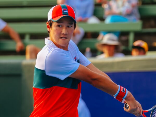 Soonwoo Kwon (KOR) hits a backhand to Milos Raonic (CAN) at the AgBioEn Kooyong Classic on Day 1 in Melbourne Australia
