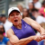 Romania's Simona Halep celebrates winning the first set during her first round match against France's Alize Cornet at the Italian Open