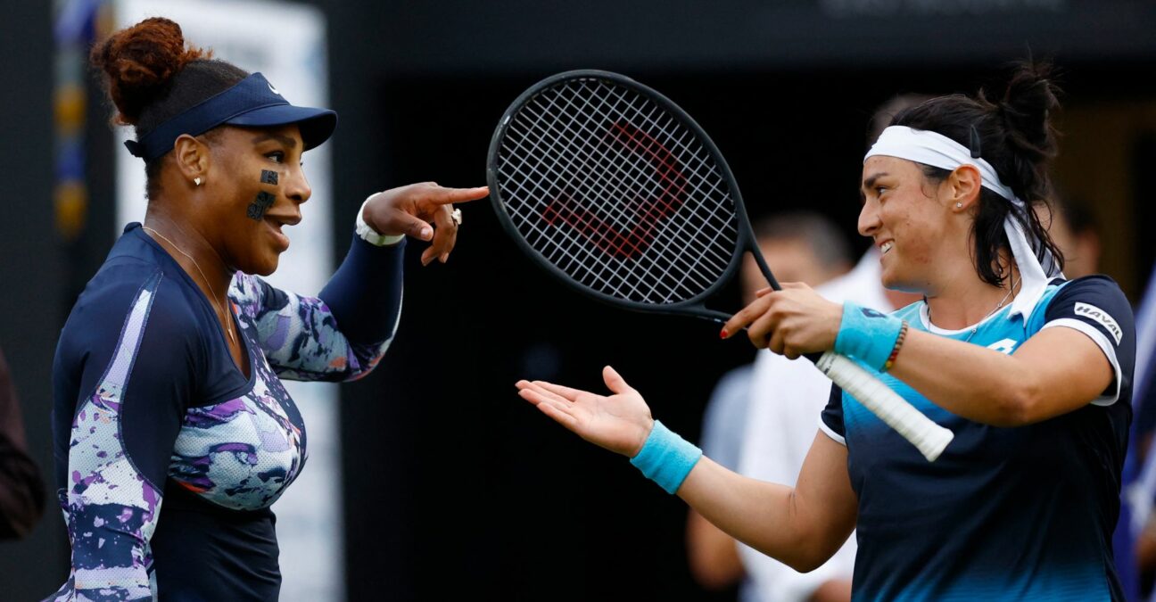 Serena Williams of the U.S. with Tunisia's Ons Jabeur during their round of 16 double match at Eastbourne International Tournament