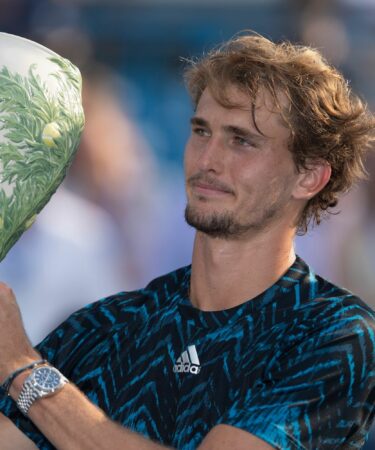 Alexander Zverev poses with the trophy after winning the Western and Southern Open final in Cincinnati
