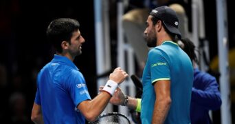 Tennis - ATP Finals - The O2, London, Britain - November 10, 2019 Serbia's Novak Djokovic shakes hands with Italy's Matteo Berrettini after winning their group stage match