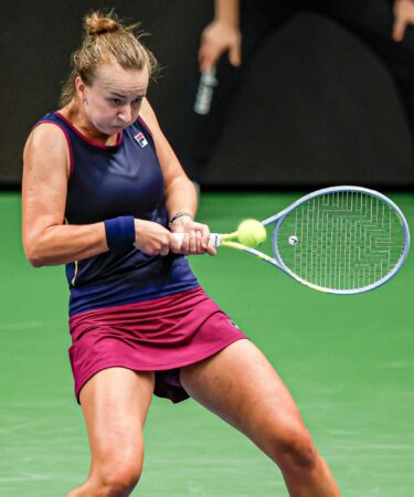 Barbora Krejcikova is hitting a return agains Belina Bencic dureing their semi-final in Tallinn in 2022.